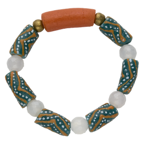 Bracelet with patterned beads and a large orange bead on a white background