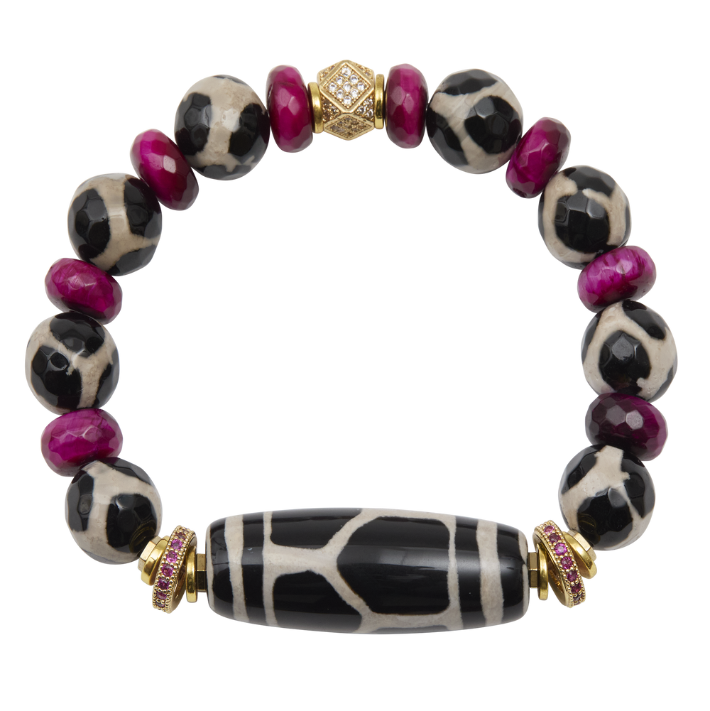 Bracelet with black and white patterned beads and gold accents on a white background