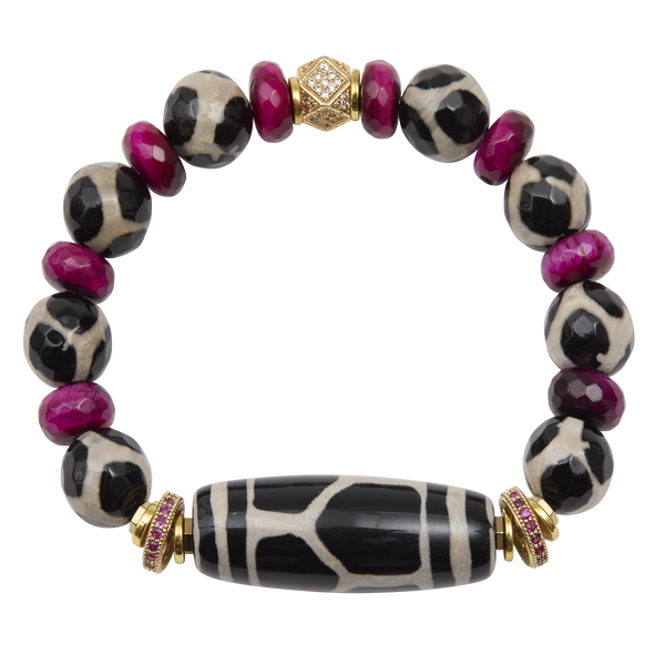 Bracelet with black and white patterned beads and gold accents on a white background