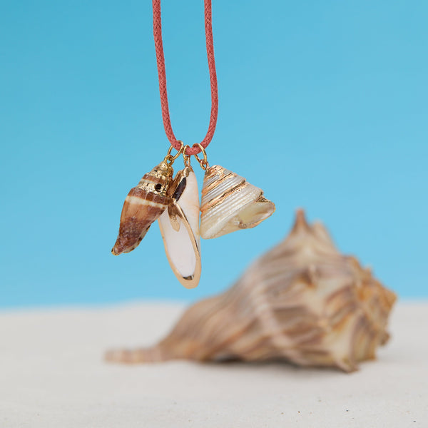 Necklace with shell pendants on a blue background