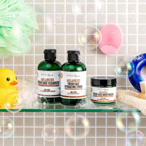 MelanKids skincare products on a bathroom shelf with bath items.