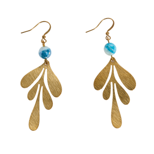 Brass leaf-shaped earrings with blue beads on a white background