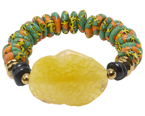Colorful beaded bracelet with a large yellow stone on a white background