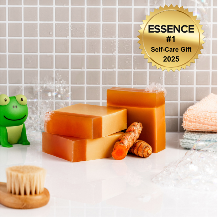 Three bars of Turmeric Acne soap Bars on a white surface with a tiled wall background