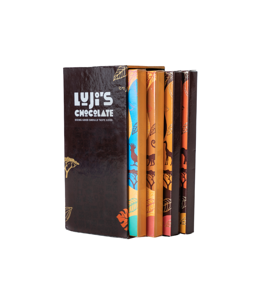 A collection of Luji's Chocolate bars displayed with their respective key ingredients, such as suya powder for the spicy suya flavor,  plantain chips for Ginger Plantain Crunch, alongside the colorful packaging of each bar.