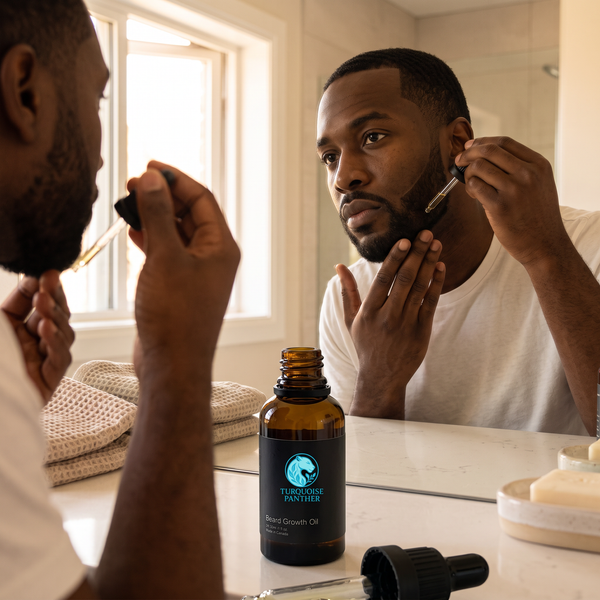 Black man applying Hemp Infused Beard Growth Oil to his jawline in front of a bathroom mirror