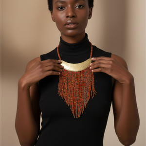 Woman wearing a black turtleneck and a beaded necklace with orange beads on a beige background