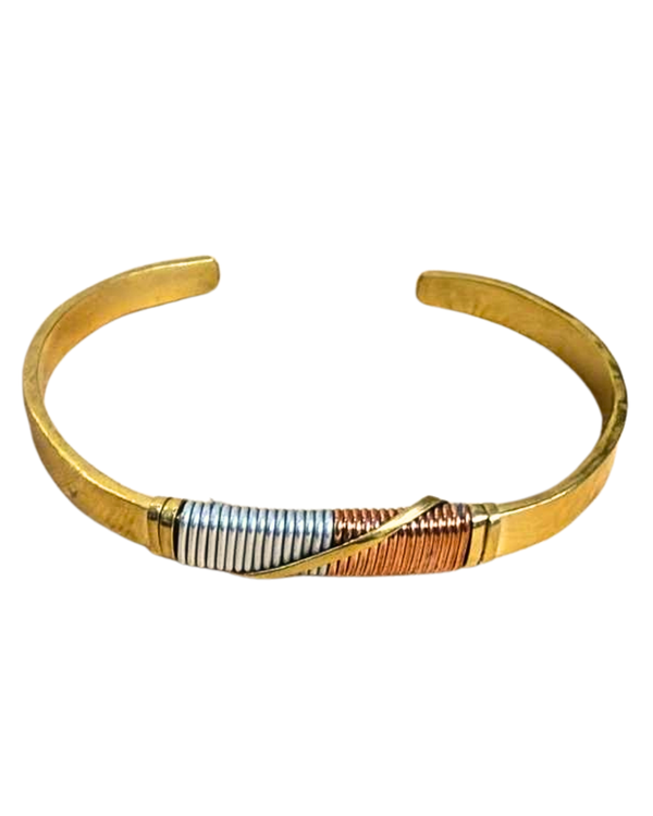 Gold bracelet with a patterned band on a white background
