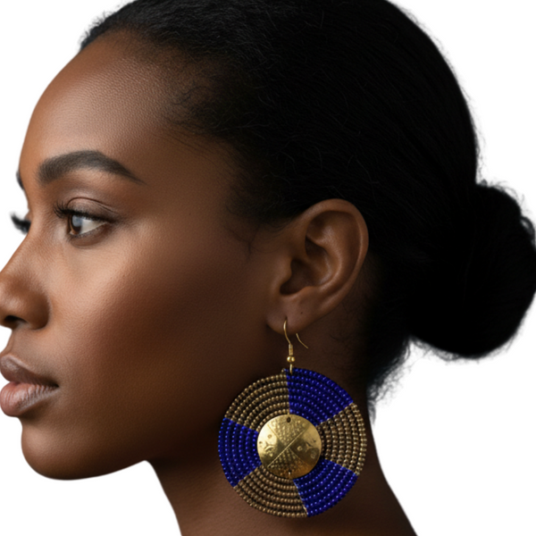 A woman wearing a blue and gold beaded earring on a white background